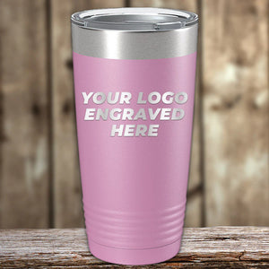 A pink Kodiak Coolers custom tumbler with a customizable engraving area for an engraved logo displayed on a wooden background.