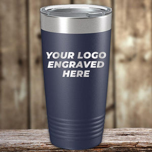 A Custom Tumbler Engraved with your Logo or Design by Kodiak Coolers, displayed on a wooden surface against a blurred wooden background, perfect as a corporate promotional gift.