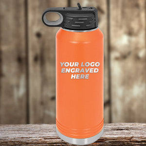 A vibrant orange Kodiak Coolers bottle with black lid and metal base sits on wood. Ideal with custom mugs, this Engraved Custom Logo Drinkware features "YOUR LOGO ENGRAVED HERE"—single side engraving included; bulk pricing available.