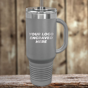 A Kodiak Coolers Custom 40 oz Travel Tumbler with Built in Handle and Straw - Stainless Steel - Special Bulk Wholesale Volume Pricing, with your business logo embossed on it, making it the perfect promotional gift.